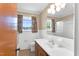 This bathroom features tile walls, decorative curtains, a toilet and a sink at 6080 Us 421 N, Lillington, NC 27546