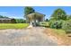 Detached metal carport structure with gravel base for boat and vehicle storage at 6080 Us 421 N, Lillington, NC 27546