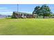 Lovely brick home featuring a well-manicured lawn and mature trees offering curb appeal at 6080 Us 421 N, Lillington, NC 27546
