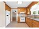 Cozy kitchen featuring wood cabinetry and stainless steel appliances at 6080 Us 421 N, Lillington, NC 27546