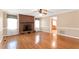 Living room showcasing a brick fireplace, hardwood floors, and natural light at 6080 Us 421 N, Lillington, NC 27546