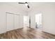 Bedroom with a fan, closet, and ensuite bathroom offers comfort and convenience at 615 Daniels St # 215, Raleigh, NC 27605