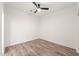 Bright, minimalist bedroom with wood-look floors and ample natural light at 615 Daniels St # 215, Raleigh, NC 27605