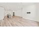 Spacious open-concept living area with a large kitchen island and sleek light wood floors at 615 Daniels St # 215, Raleigh, NC 27605