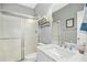 Modern bathroom featuring a glass shower and a sink with marble countertop at 619 E Hatterleigh Ave, Hillsborough, NC 27278