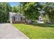 Picture of a charming single-Gathering home with a well-kept lawn and long driveway at 619 E Hatterleigh Ave, Hillsborough, NC 27278