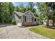 A beautiful single-Gathering home boasts an attached garage and a well-manicured lawn at 619 E Hatterleigh Ave, Hillsborough, NC 27278