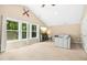 Cozy living room features vaulted ceilings, a large window with natural light and a comfortable seating area at 619 E Hatterleigh Ave, Hillsborough, NC 27278