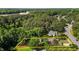An aerial view of a house with its property lines marked in yellow for estimation at 624 Powhatan Dr, Fuquay Varina, NC 27526