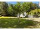 Lush backyard with mature trees offers a private and peaceful outdoor space at 624 Powhatan Dr, Fuquay Varina, NC 27526