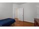 Bedroom with bed, dresser, and dark wood floors at 624 Powhatan Dr, Fuquay Varina, NC 27526