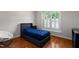 Bedroom with a bed, a window, and dark wood floors at 624 Powhatan Dr, Fuquay Varina, NC 27526