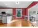 Bright dining area with large windows and access to a sunroom at 624 Powhatan Dr, Fuquay Varina, NC 27526