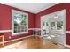 Bright dining area adjacent to a sunroom filled with natural light at 624 Powhatan Dr, Fuquay Varina, NC 27526