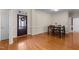 Inviting dining room with hardwood floors and a view of the front entry at 624 Powhatan Dr, Fuquay Varina, NC 27526