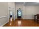 Open entryway with hardwood floors and view of the dining room and living room at 624 Powhatan Dr, Fuquay Varina, NC 27526