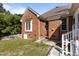 Rear exterior view with brick facade and fenced in yard at 624 Powhatan Dr, Fuquay Varina, NC 27526