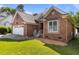 Charming brick home with two car garage and well-manicured lawn at 624 Powhatan Dr, Fuquay Varina, NC 27526