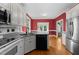 Modern kitchen with stainless steel appliances and hardwood floors at 624 Powhatan Dr, Fuquay Varina, NC 27526