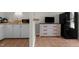 Kitchenette with cabinetry, sink, microwave, mini fridge and breakfast bar at 624 Powhatan Dr, Fuquay Varina, NC 27526