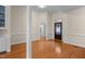 Open-concept living area with hardwood floors and seamless flow to other rooms at 624 Powhatan Dr, Fuquay Varina, NC 27526
