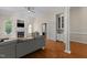 Cozy living room with a fireplace, built-in shelving, and hardwood flooring at 624 Powhatan Dr, Fuquay Varina, NC 27526