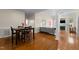 Spacious living room with a dining area and hardwood floors at 624 Powhatan Dr, Fuquay Varina, NC 27526