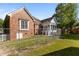 Rear exterior view with brick facade and fenced in yard at 624 Powhatan Dr, Fuquay Varina, NC 27526