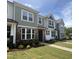 Charming townhomes with stone accents, multiple windows and beautifully landscaped front yards at 6447 Granite Quarry Dr, Raleigh, NC 27610