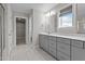 Stylish bathroom features modern vanity, ample storage, and access to a walk-in closet at 6624 Vestal St, Wake Forest, NC 27587