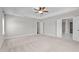 Spacious bedroom features neutral walls, carpet, ceiling fan, and ensuite bathroom access at 6624 Vestal St, Wake Forest, NC 27587