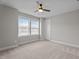Neutral bedroom featuring a ceiling fan, window, and plush carpeting at 6624 Vestal St, Wake Forest, NC 27587