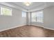 Cozy bedroom with hardwood floors and three large windows at 6624 Vestal St, Wake Forest, NC 27587