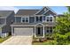 Charming two-story home with a two car garage and beautiful landscaping at 6624 Vestal St, Wake Forest, NC 27587