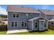 Exterior backyard view of a gray two-story house with a concrete patio at 6624 Vestal St, Wake Forest, NC 27587
