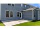 Exterior backyard view of a gray two-story house with a concrete patio at 6624 Vestal St, Wake Forest, NC 27587