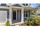 Inviting front porch with white columns and stylish front door at 6624 Vestal St, Wake Forest, NC 27587