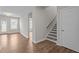 Hallway with a stairwell leading to the upper level and access to a living space at 6624 Vestal St, Wake Forest, NC 27587