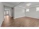 Bright living room featuring hardwood floors and a view into the next room at 6624 Vestal St, Wake Forest, NC 27587