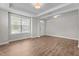 Bright living room featuring hardwood floors and a large window at 6624 Vestal St, Wake Forest, NC 27587