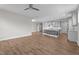 Open-concept living area showcasing wood floors that flow seamlessly into the kitchen and dining spaces at 6624 Vestal St, Wake Forest, NC 27587
