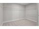 Spacious walk-in closet with ample shelving and carpet for organized storage solutions at 6624 Vestal St, Wake Forest, NC 27587