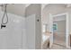 Shower and soaking tub sit adjacent to an open doorway to the bedroom area at 8140 Consella Way, Willow Springs, NC 27592