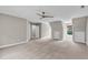 A light filled bedroom with neutral walls, plush carpet, a ceiling fan and natural light streaming in from a window at 8140 Consella Way, Willow Springs, NC 27592