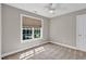 Bedroom with carpet, baseboard and a large window allowing natural light into the room at 8140 Consella Way, Willow Springs, NC 27592