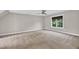 Spacious bedroom with neutral walls, plush carpeting and a window overlooking a scenic outdoor view at 8140 Consella Way, Willow Springs, NC 27592