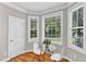 Bright breakfast nook with a glass table, chairs, and multiple windows for natural light at 8140 Consella Way, Willow Springs, NC 27592