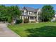 Charming two-story home with a well-manicured lawn and inviting front porch at 8140 Consella Way, Willow Springs, NC 27592