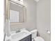 Charming half bath features a modern vanity, brushed nickel finishes, and clean design at 8140 Consella Way, Willow Springs, NC 27592