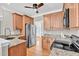 Spacious kitchen with stainless steel appliances, granite countertops, and light wood cabinets at 8140 Consella Way, Willow Springs, NC 27592